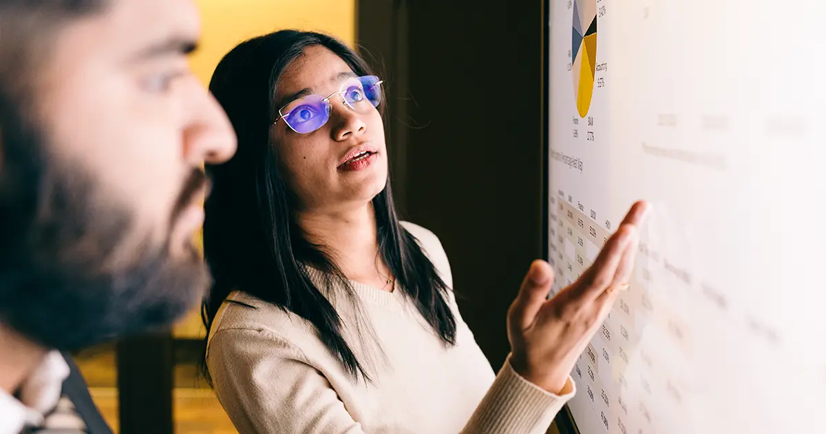 Two students look at a screen
