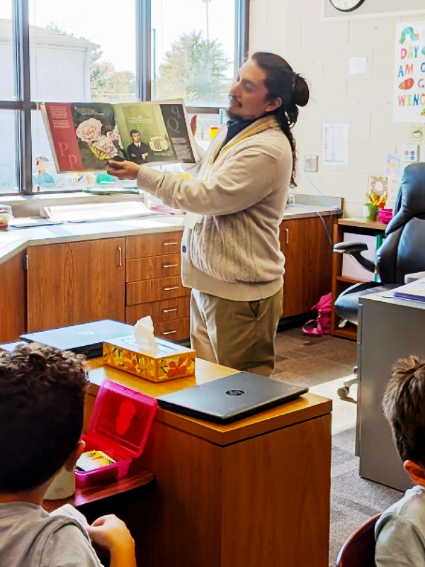 Top: Elementary students listening to book reading Bottom: October is Economic Education Month