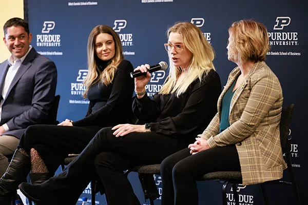 Four people on a panel in conversation