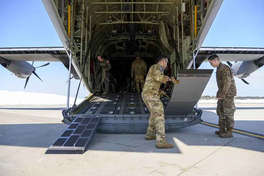 Military plane being loaded with equipment