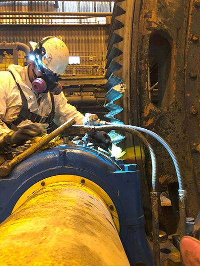 William working on a machine