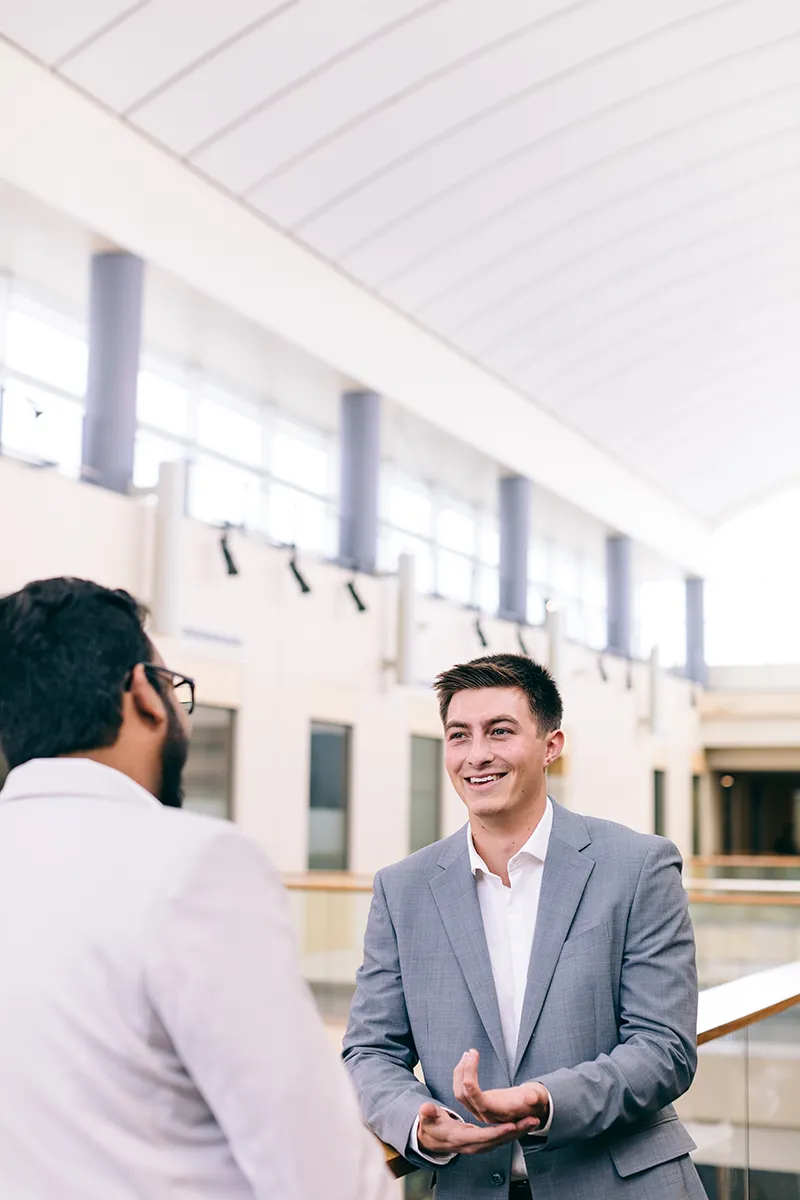 Two people discussing admissions