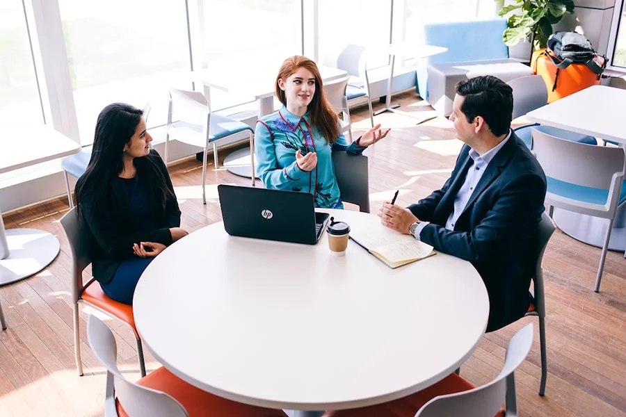 Three students chatting