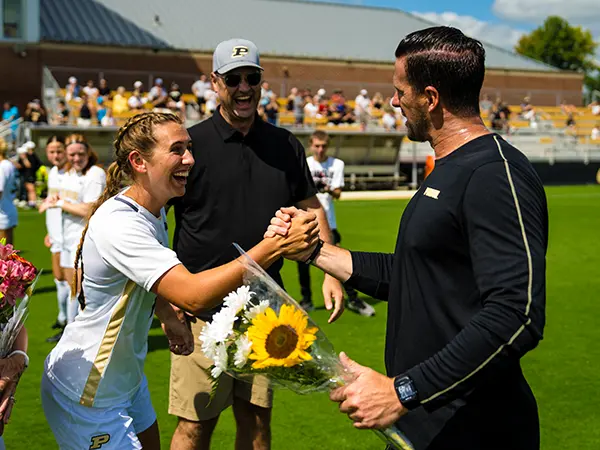 Roy shakes hands with her coach