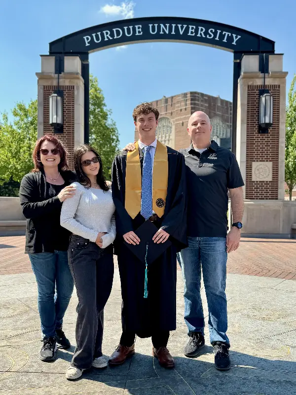 The Kapala family pose outside the Purdue University arch