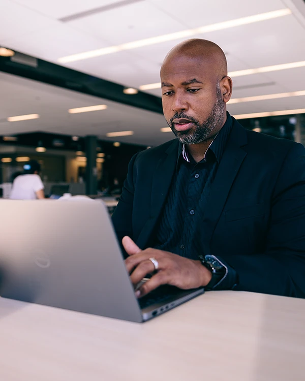 Graduate student working on laptop
