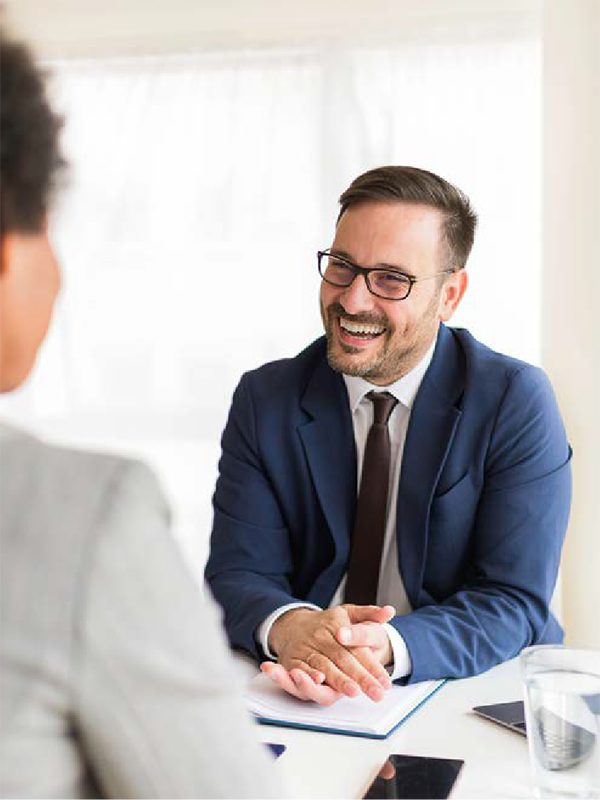 Man smiling in an interview