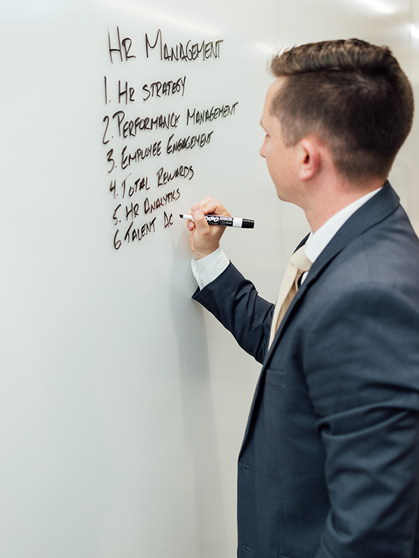 Man writing on a whiteboard
