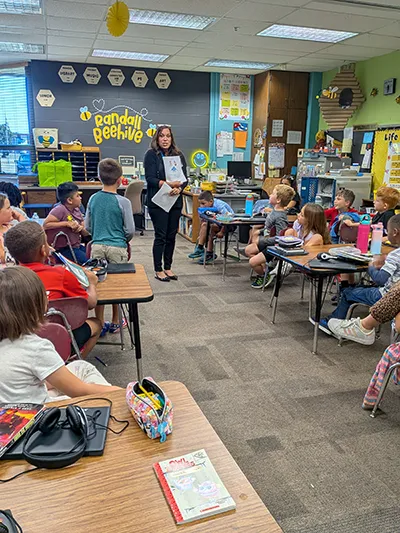 Amber S. Vanaman reading to children