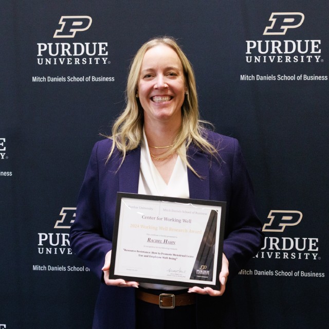 Rachel Hahn holding award