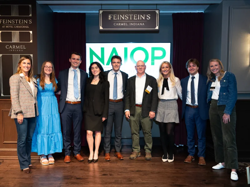 Smiling students and faculty at event