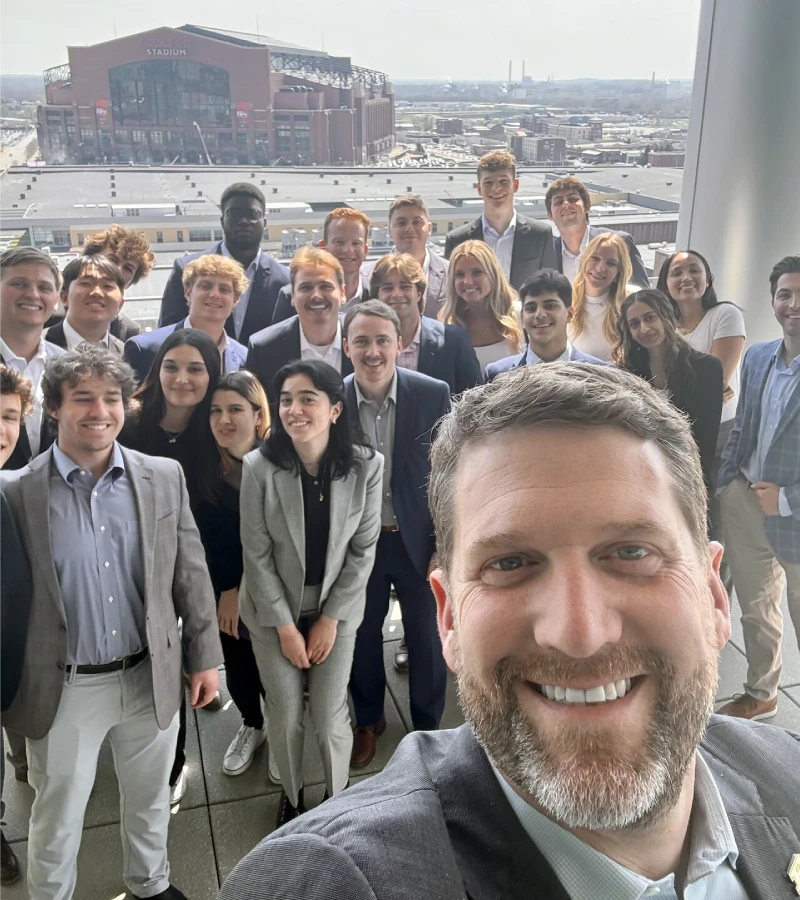 Professor with students take selfie