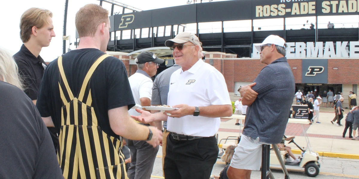 Real estate alumni and students outside Ross-Ade Stadium