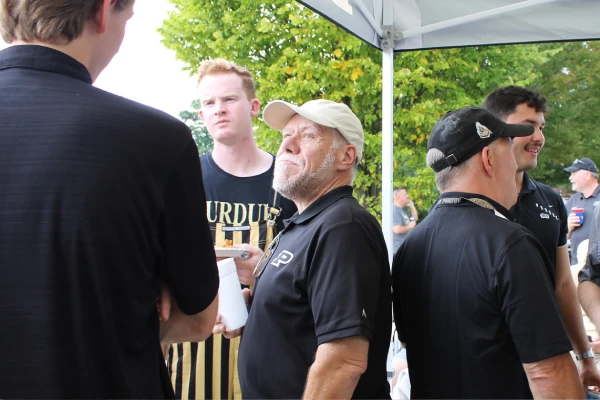 Group of alum and students in conversation