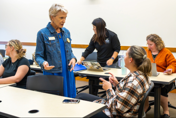 Erika Steuterman in conversation with student