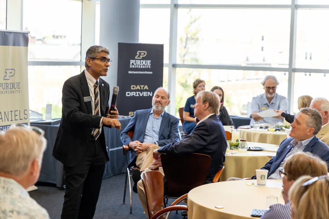 Professor speaking at event