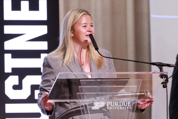 Brooke Evans speaking at podium
