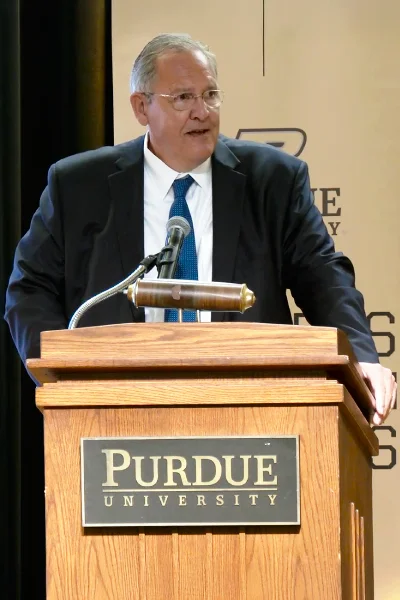 Greg Hayes speaking at podium