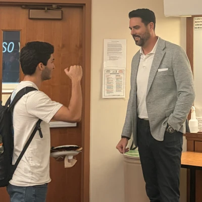 Matt Carroll in conversation with student Pablo Rivera