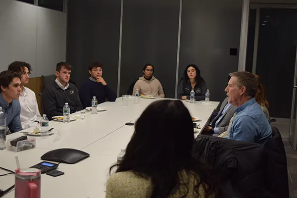 Steve Cook talking with students