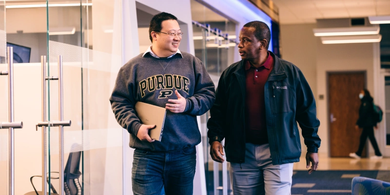 student and advisor in conversation