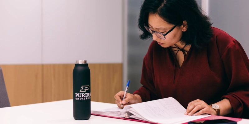 Student making list at desk