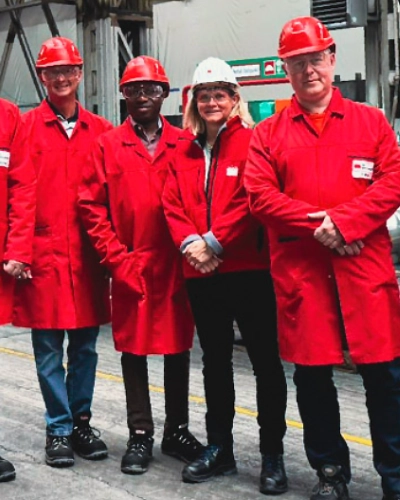 Group wearing PPE at steel plant in Germany
