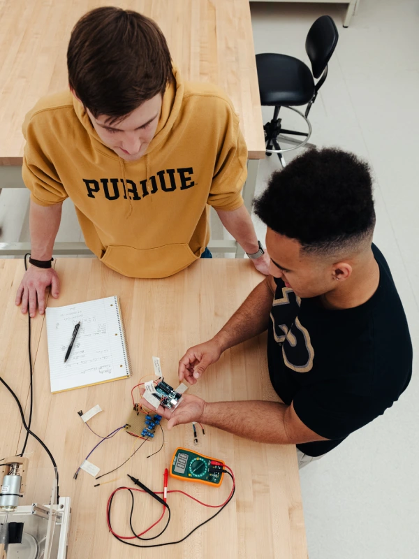 Two students working on hardware project