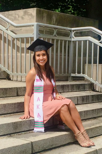 Ariana Diaz wearing graduation cap and AKA sash