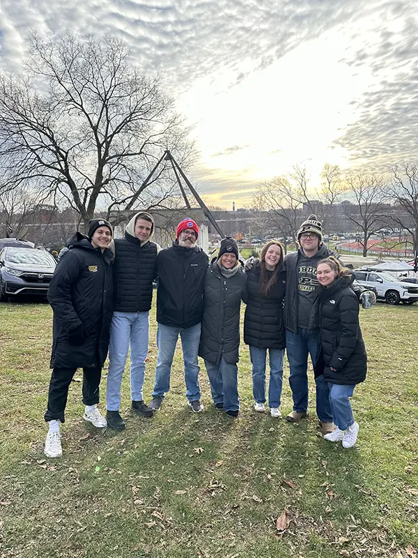 Bella (third from left) with her family and friends at Slayter Hill tailgating the Purdue vs IU game