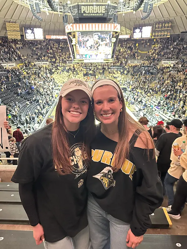 Bella (left) with a friend at Mackey Arena