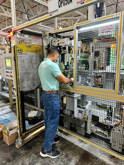 Sam completing tests on a machine