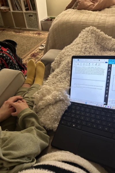 Miller studying with son on lap by computer
