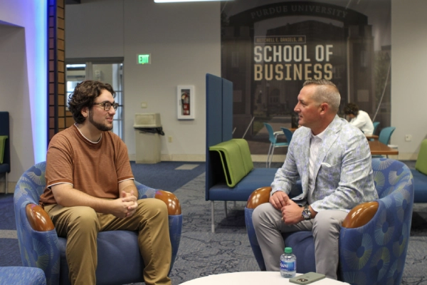 Student in conversation with executive