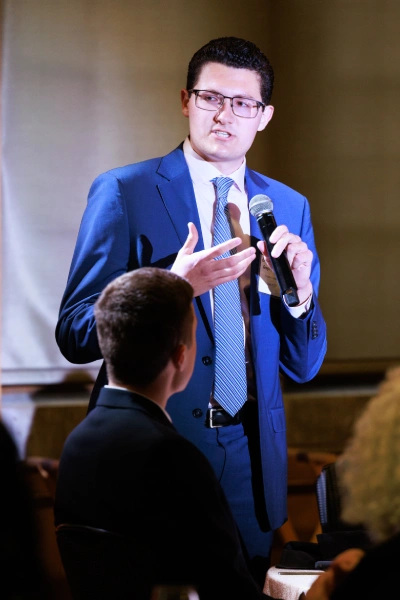 Gregory Kotsiviras speaking at event