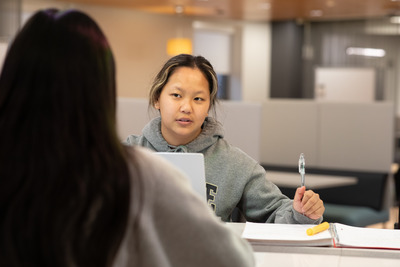 Haleigh speaking with alumni