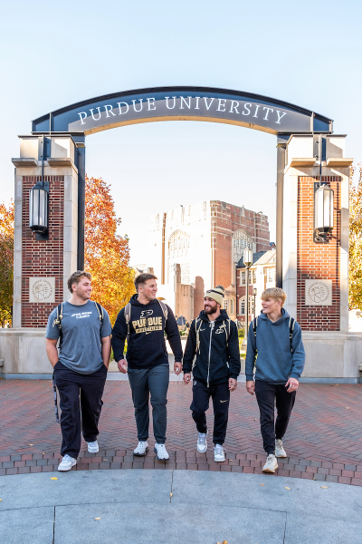 Hayden Filipovich and friends under the Purdue sign