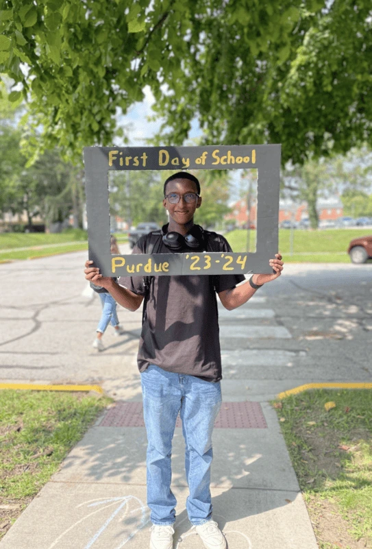 A cardboard cut-out picture frame headshot by Salt on campus on my way to my first day of class in Fall 2024.