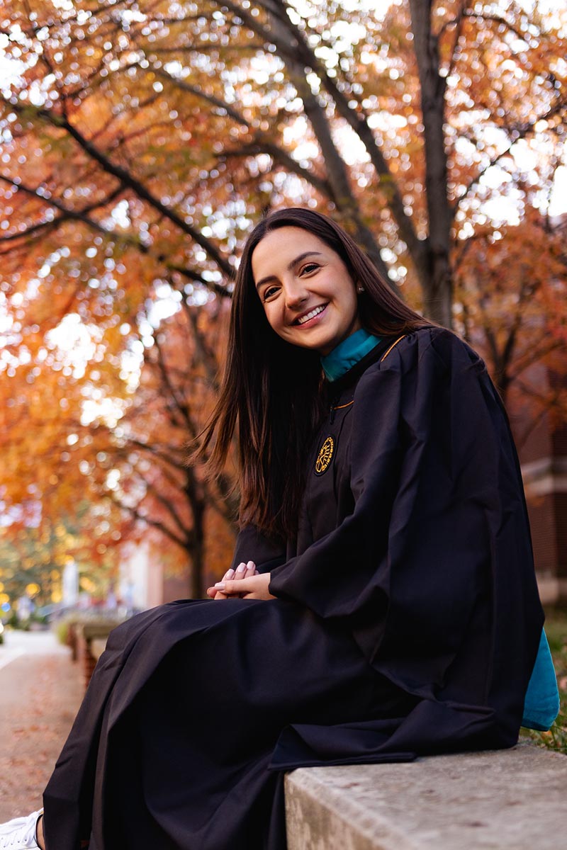 Ariana posing on bench