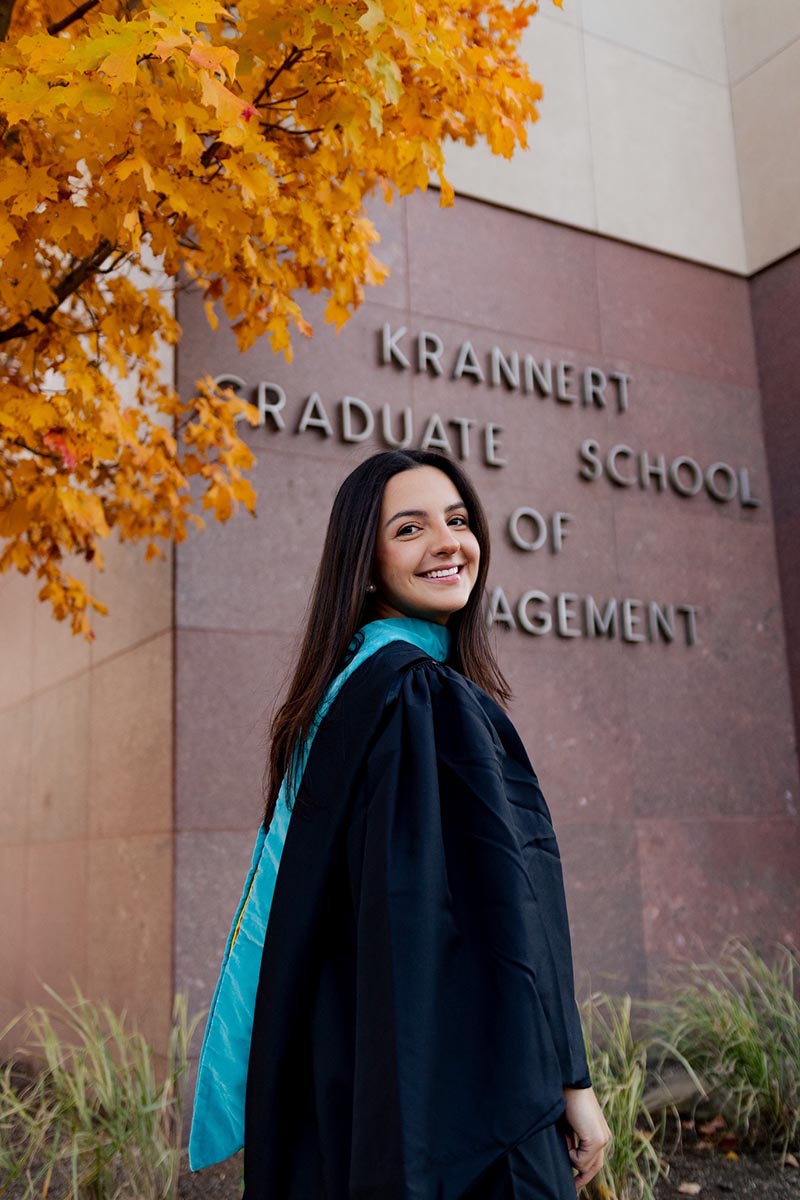 Ariana posing in front of Krannert sign