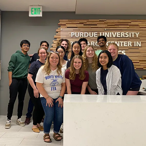Here I am with my fellow undergraduate research assistants back in 2023, in the Krannert Building's Purdue University Research Center in Economics suite. 