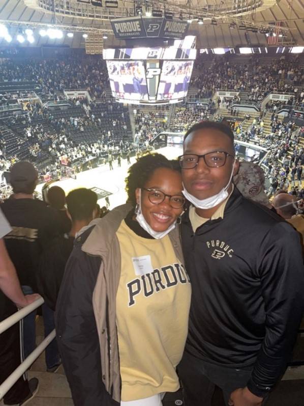 shanise and student posing for a picture in a stadium