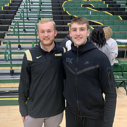 Kyle standing next to Braden Smith